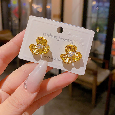 Buy Golden Small Flower Stud Earrings For Women online at Fashionner.