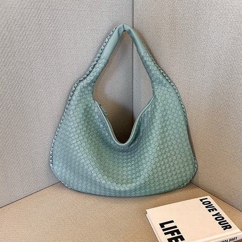 Sac tissé haut de gamme français pour femme, sac polyvalent à bandoulière ou à l'épaule, sac de transport transfrontalier texturé de niche, portable pour les trajets quotidiens