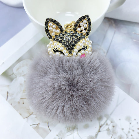 Porte-clés pendentif en alliage, perles, strass et fourrure de renard