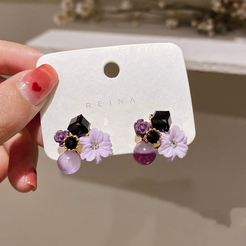 Buy Korean East Gate Diamond Cat''S Eye Crystal Flower Earrings online at Fashionner.