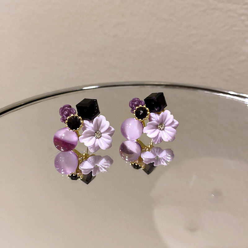 Buy Korean East Gate Diamond Cat''S Eye Crystal Flower Earrings online at Fashionner.