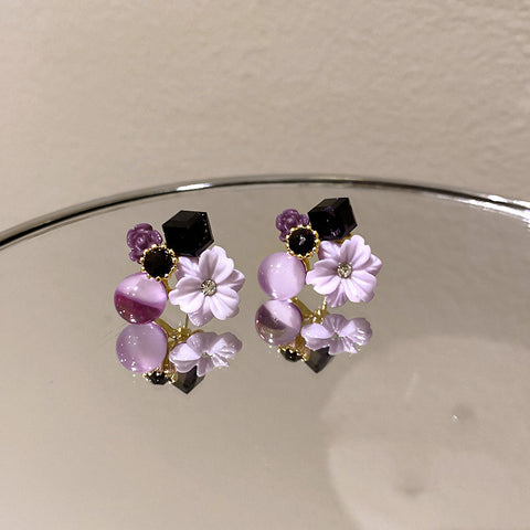 Buy Korean East Gate Diamond Cat''S Eye Crystal Flower Earrings online at Fashionner.
