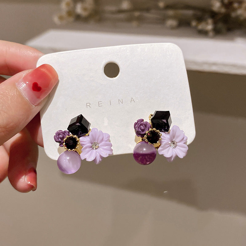 Buy Korean East Gate Diamond Cat''S Eye Crystal Flower Earrings online at Fashionner.