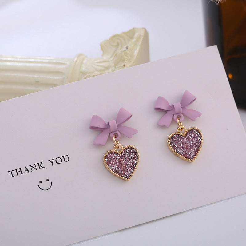Buy New Korean Style Purple Bow Sequin Love Heart Clip On Earrings Sweet online at Fashionner.