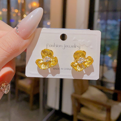 Buy Golden Small Flower Stud Earrings For Women online at Fashionner.