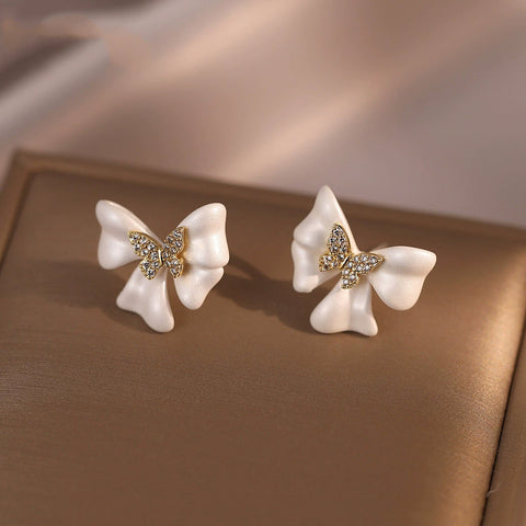 Buy French-Style Delicate White Bow Stud Earrings online at Fashionner.