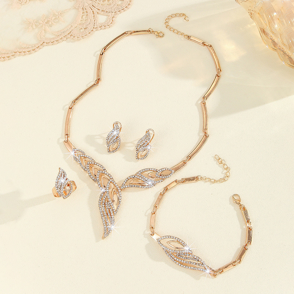 Buy Gold Leaf Diamond-Encrusted Necklace Earrings Ring Bracelet Set online at Fashionner.