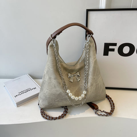 Sac à bandoulière simple et décontracté, style niche, pour femme, avec une touche d'élégance.