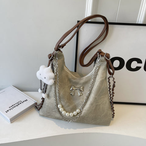 Sac à bandoulière simple et décontracté, style niche, pour femme, avec une touche d'élégance.