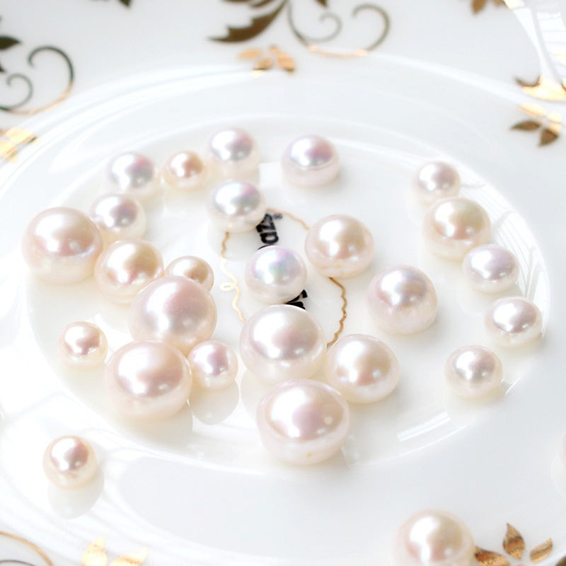 Buy Half-Hole Aurora-Colored Natural Freshwater Flat-Round White Pearls online at Fashionner.
