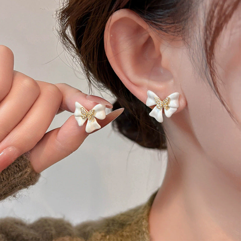 Buy French-Style Delicate White Bow Stud Earrings online at Fashionner.