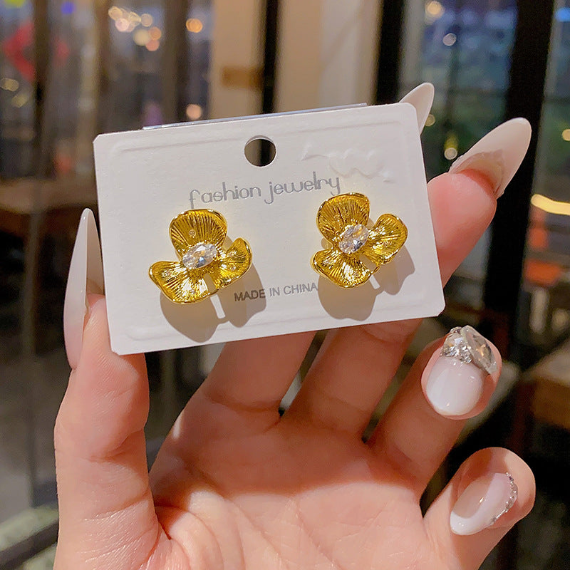 Buy Golden Small Flower Stud Earrings For Women online at Fashionner.