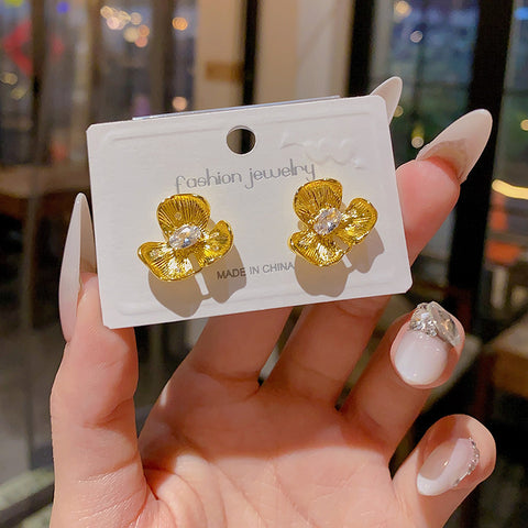 Buy Golden Small Flower Stud Earrings For Women online at Fashionner.