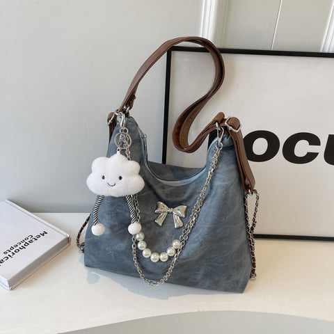 Sac à bandoulière simple et décontracté, style niche, pour femme, avec une touche d'élégance.
