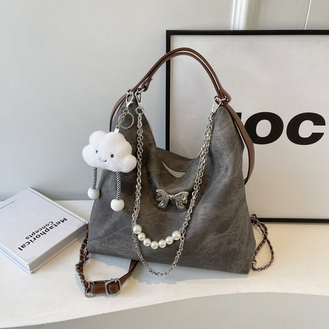 Sac à bandoulière simple et décontracté, style niche, pour femme, avec une touche d'élégance.