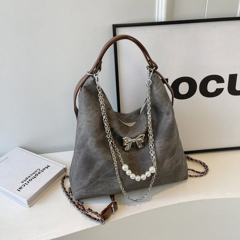 Sac à bandoulière simple et décontracté, style niche, pour femme, avec une touche d'élégance.