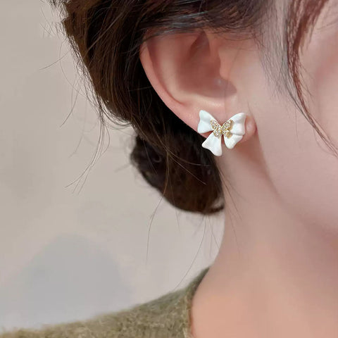 Buy French-Style Delicate White Bow Stud Earrings online at Fashionner.