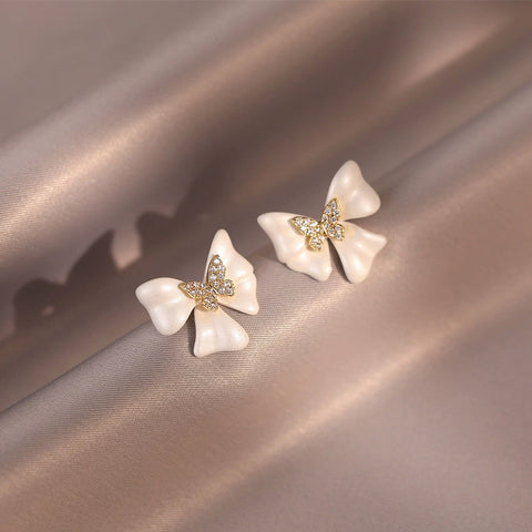 Buy French-Style Delicate White Bow Stud Earrings online at Fashionner.