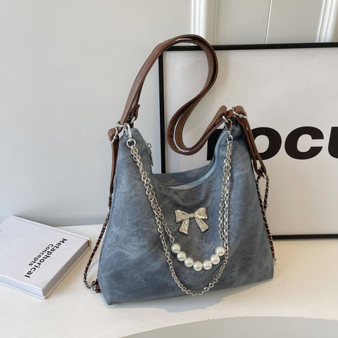 Sac à bandoulière simple et décontracté, style niche, pour femme, avec une touche d'élégance.