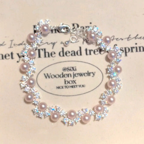 Buy Exquisite French-Style Sparkling Diamond And Pearl Bracelet For Women online at Fashionner.