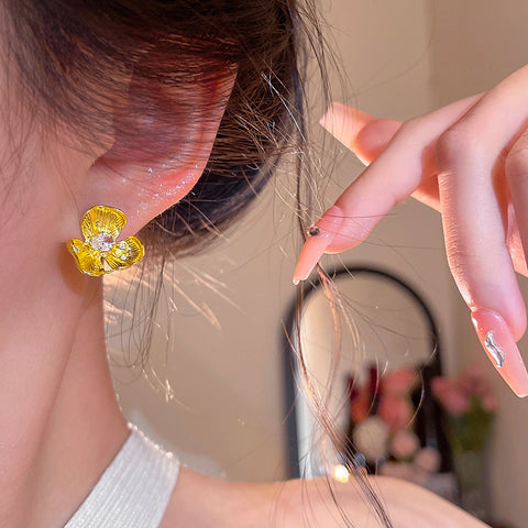 Buy Golden Small Flower Stud Earrings For Women online at Fashionner.